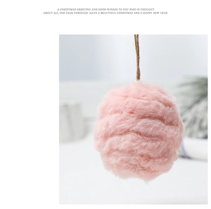 Close-up of a 6cm pink felt wool ball ornament with rustic hemp rope for Christmas decor