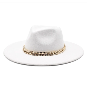 Detailed close-up of white wool fedora hat featuring a chunky gold chain band accessory