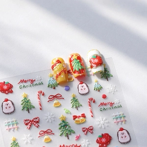 3D Christmas embossed nail stickers featuring festive trees, snowflakes, and candy canes
