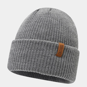 Detailed view of gray rib-knit beanie with brown leather label and premium stitching