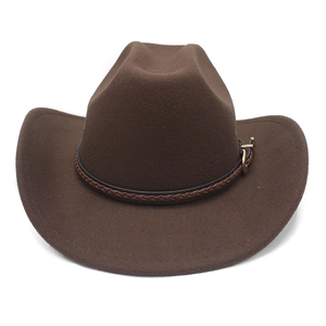 Detail of dark brown felt cowboy hat with braided leather band and gold buckle