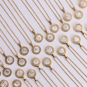 Array of 26 English letter pendants with rhinestones and mother of pearl inlay