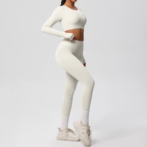 Side view of cream yoga set featuring long sleeve crop top and high waist leggings