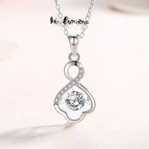 Macro shot of S925 sterling silver infinity necklace with sparkling round-cut zircon