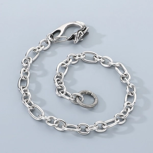 Detailed view of skull lobster clasp and round ring on heavy steel hip hop wallet chain