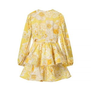 Flat lay back view of yellow floral print dress with puff sleeves and layered hem