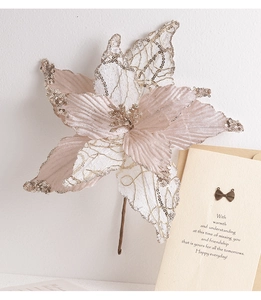 Detailed view of artificial champagne pink Christmas flower with sequins and petals