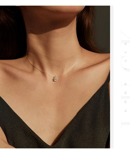 Close-up of elegant pear-cut moissanite pendant on a minimalist invisible fishline chain