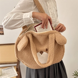Detail of cute plush bear tote bag with smooth zipper closure and fuzzy shoulder strap