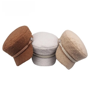 Three wool newsboy hats in coffee and beige with decorative braided ropes and metal buttons