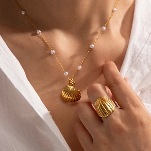 Luxury 18K gold plated shell necklace and ring set with pearls on elegant model
