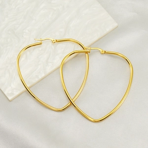 Minimalist 18K gold heart shaped stainless steel hoop earrings for women on marble