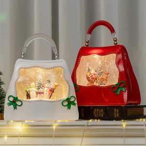 Lighted Christmas handbag water globes with Santa and snowman scenes for festive decor