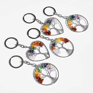 Handcrafted tree of life keychains in heart and round shapes with colorful crystals