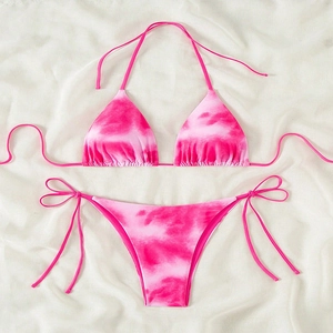 Detail of pink and white tie-dye bikini set with adjustable side ties and halter neck