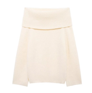 Close-up of creamy white knitted sweater showing off-shoulder collar and soft fabric texture