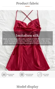 Detailed fabric texture of red satin backless slip dress showing its smooth silk-like finish