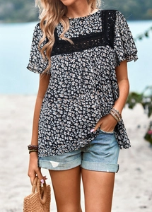 Detail of leopard print top featuring intricate black lace hollow patchwork on the chest