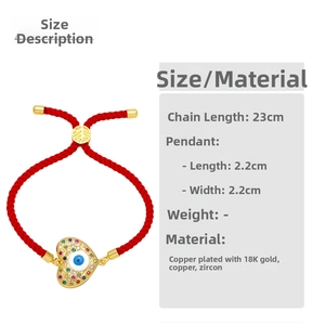 Macro detail of red string heart bracelet with blue evil eye and colorful zircon stones