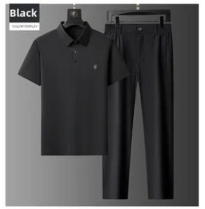 Detail view of men's black ice silk polo suit with metal shield badge on chest