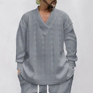 Detail of grey V-neck knit sweater and drawstring trousers with waffle texture