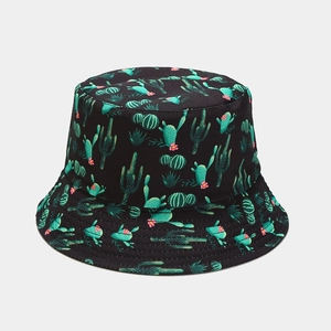 Close-up of a black bucket hat featuring green cactus and pink flower patterns