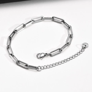 Detail of silver paperclip chain bracelet with adjustable link and lobster clasp