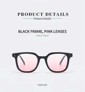 Front detail of black frame sunglasses with pink gradient blush lenses and silver studs