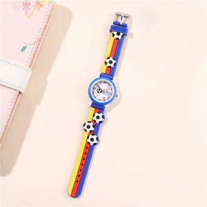 Detail of blue silicone watch strap with 3D soccer ball patterns for kids sports watch