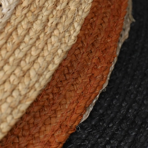 Macro shot of natural raffia weave texture in beige, rust red and black colors