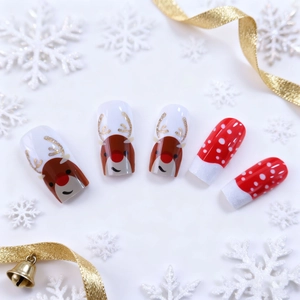 Christmas press-on nails with reindeer and glitter patterns on festive red and white bases
