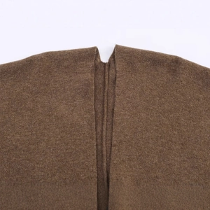 Women's dark brown long knitted cape with premium textured wool finish in minimalist style