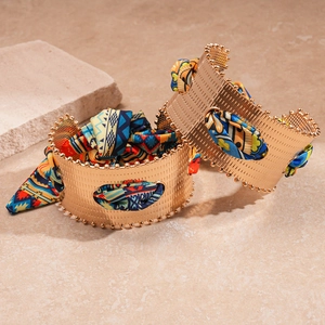 Vintage gold cuff bracelet with colorful ethnic silk scarf wrap and textured metal finish