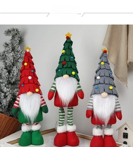 Three Christmas forest gnomes with tree-shaped hats and star toppers for home decor