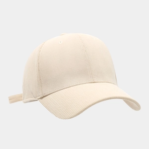 Close-up of fine corduroy texture and adjustable strap on a cream baseball cap