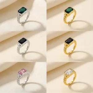 Detail showing twisted rope rings with rectangular glass stones in green, black and pink