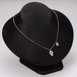 Golden stainless steel Hamsa and Evil Eye pendant necklace with blue cubic zirconia