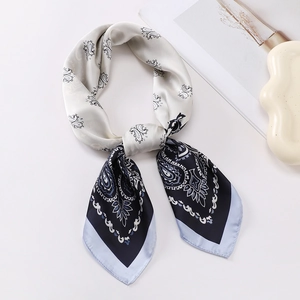 Detailed view of paisley silk square scarf with premium stitching and elegant blue floral pattern