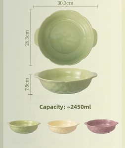 Detail of 12-inch ceramic soup bowl with handles in cream green and taro purple