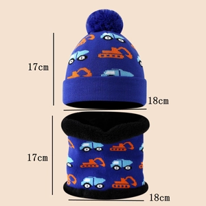 Detailed view of child knitted set showing warm black fleece lining and excavator pattern