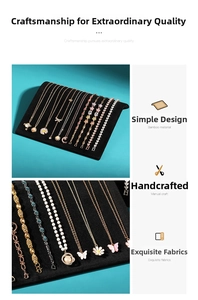 Detailed view of gold plated necklaces and bracelets on black jewelry display stand
