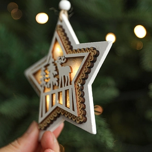 Luminous white wooden star ornament with reindeer forest scene and warm LED light