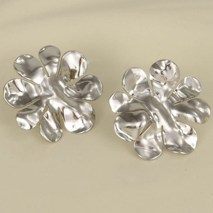 Close-up of silver flower stud earrings in 304 stainless steel with a metallic finish