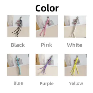Detail of colorful woven wax thread tassel heart keychains with silver lobster clasps