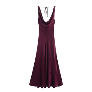 Detail view of burgundy satin slip dress showing draped neckline and glossy fabric texture