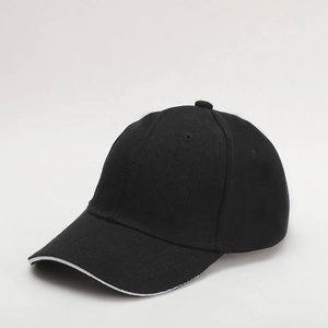Detail view of the black baseball cap showing the twill fabric texture and white edge line