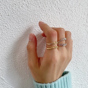 Close-up of irregular bubble textured S925 silver rings with organic branch-like design