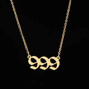 Gold stainless steel 999 angel number pendant necklace with gothic font on black background