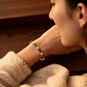 Vintage 18k gold plated bracelet with emerald square stones and clover zircon accents