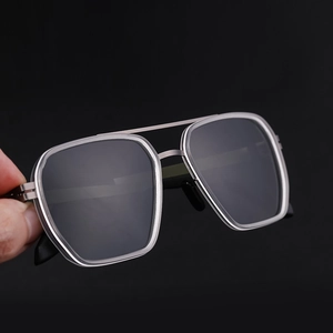 Detail of polarized aviator sunglasses with silver metal double bridge frame and dark lenses